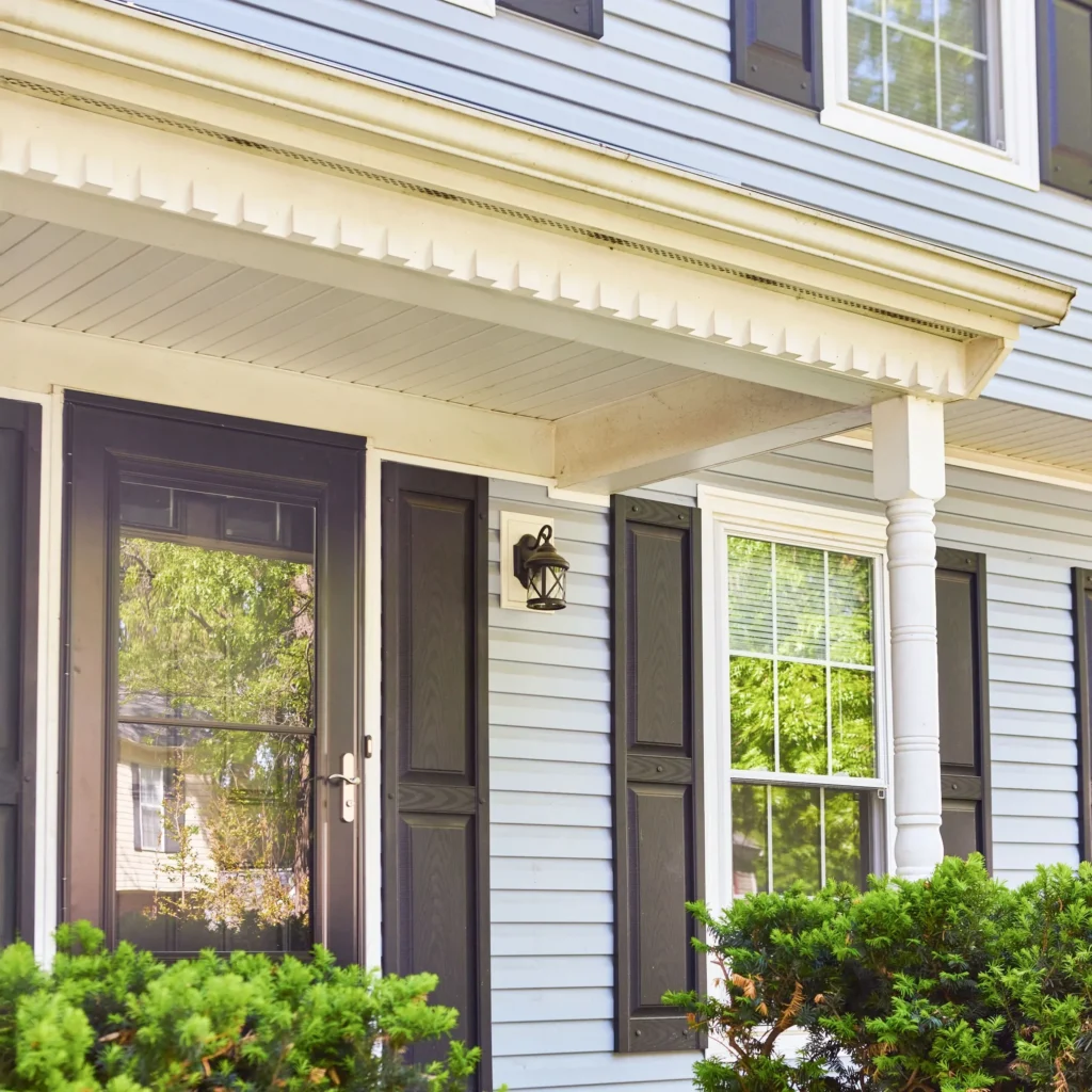 Blue Siding House Covered Front Porch White Trim 2500x2500