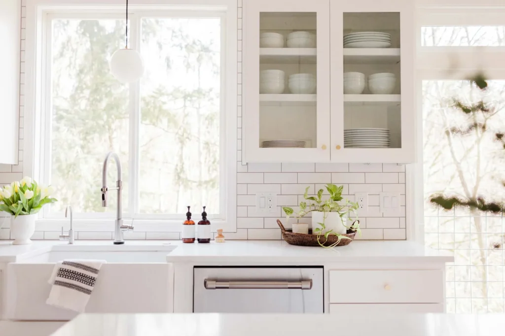 Renovated Kitchen White Quartz Top Ceramic_sink Facing Window